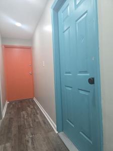 a blue door and a red door in a room at Comfy 1BR Apt. in Pleasant Ridge in Cincinnati