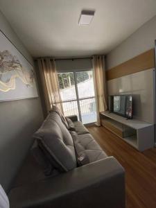 TV a/nebo společenská místnost v ubytování Apartamento Aconchegante Nogueira
