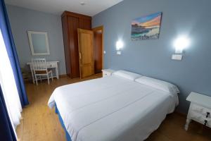 Posteľ alebo postele v izbe v ubytovaní Hotel Campomar