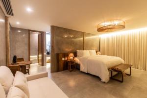 Ein Bett oder Betten in einem Zimmer der Unterkunft Yemanjá Hotel by Preabeach Experience
