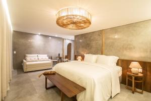 Ein Bett oder Betten in einem Zimmer der Unterkunft Yemanjá Hotel by Preabeach Experience