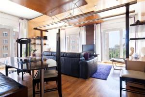 a living room with a couch and a table at Stay U-nique Apartments Salvador Espriu in Barcelona