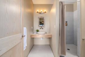 a bathroom with a sink and a shower at Cathedral Spires Luxury Home Tucked in the MTN'S in Colorado Springs +47 photos