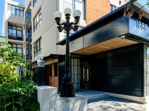 a street light in front of a building at Roma 1888 in Guadalajara