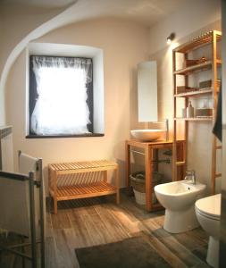 a bathroom with a sink and a toilet at Cascina Brunod in Chiaverano