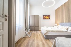 Postel nebo postele na pokoji v ubytování Apartmánový Dům Centrum