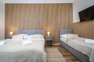 Postel nebo postele na pokoji v ubytování Apartmánový Dům Centrum