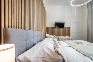Postel nebo postele na pokoji v ubytování Apartmánový Dům Centrum