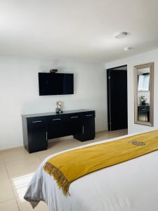 Postel nebo postele na pokoji v ubytování Saint George Hotel - Spa & Temazcal