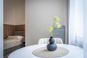 Postel nebo postele na pokoji v ubytování Apartmánový Dům Centrum