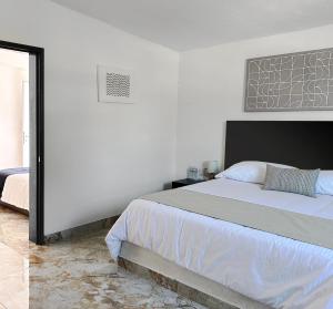 Ein Bett oder Betten in einem Zimmer der Unterkunft DUNAMIS HOTEL