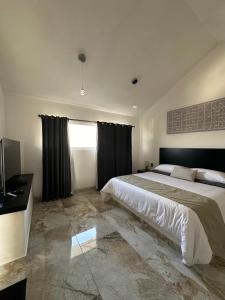 Ein Bett oder Betten in einem Zimmer der Unterkunft DUNAMIS HOTEL