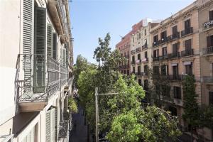 a street in a city with buildings and a pole at Stay U-nique Apartments Fontanella in Barcelona