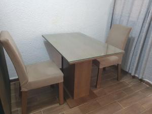 a table and two chairs sitting next to a table at loft de Angel in Salina Cruz