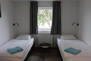 Voodi või voodid majutusasutuse Höfn Hostel toas