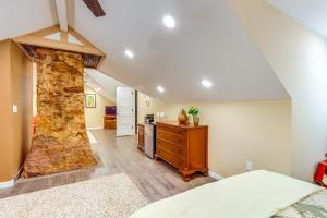 a bedroom with a stone wall in a room at Historic Dahlonega Home with Hot Tub and Porch! in Dahlonega