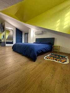 En eller flere senge i et værelse på Mirabella Loft