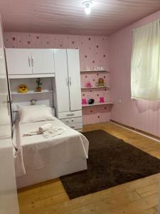 Ένα ή περισσότερα κρεβάτια σε δωμάτιο στο Casa aconchegante