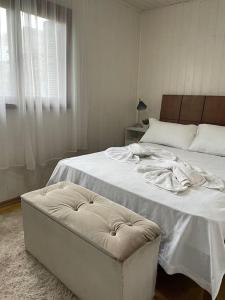 Ένα ή περισσότερα κρεβάτια σε δωμάτιο στο Casa aconchegante