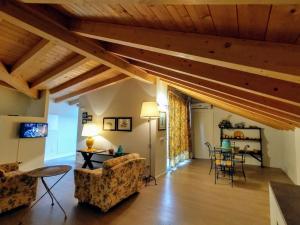 a living room with two couches and a table at Casa Larius in Como
