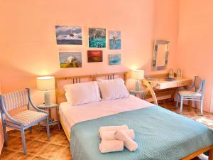 Postel nebo postele na pokoji v ubytování Villa Il Paradiso Andros