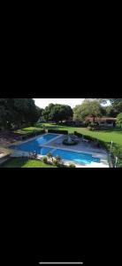 Bazén v ubytování Las Palmeras nebo v jeho okolí