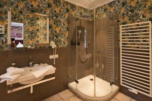 a bathroom with a shower and a sink at Egestorfer Hof in Egestorf +46 photos