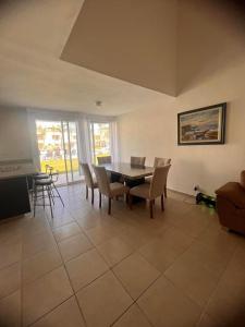 a dining room with a table and chairs at Residencial Terrasol Villa 342 in Acapulco