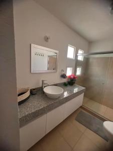 a bathroom with a sink and a mirror at Residencial Terrasol Villa 342 in Acapulco