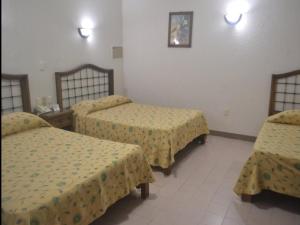 Postel nebo postele na pokoji v ubytování Hotel ARCADIO