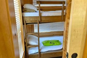 a couple of bunk beds in a room at Plymouth Rock Camping- Vacation Cottage in Elkhart Lake +13 photos
