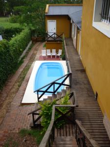 a swimming pool on the side of a building at Puerto Escondido in Colón