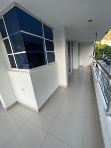 an empty room with a large window in a building at Apartamentos Pinos del Rodadero in Santa Marta