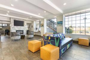 a living room with a couch and a tv at Best Western Marina State Beach in Marina