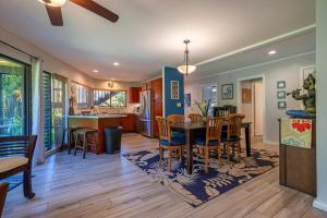 a kitchen and dining room with a table and chairs at Mauna Kai 5A in Princeville