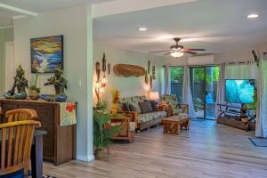 a living room with a couch and a table at Mauna Kai 5A in Princeville