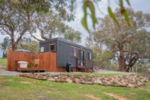 a black and orange tiny house in a park at Away At Ancell in Hindmarsh Valley