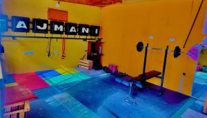 a room with a gym with a sign on the wall at Peru Hostel Tajmani in Arequipa