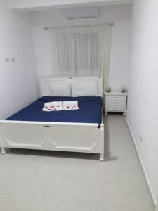 En eller flere senge i et værelse på Villa Vintage