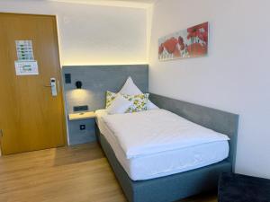 Postel nebo postele na pokoji v ubytování Hotel Restaurant Thum