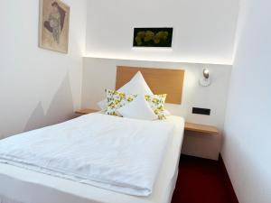 Postel nebo postele na pokoji v ubytování Hotel Restaurant Thum