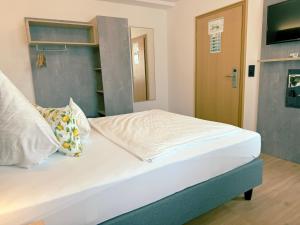 Postel nebo postele na pokoji v ubytování Hotel Restaurant Thum