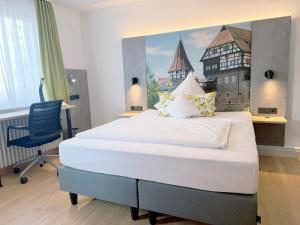Postel nebo postele na pokoji v ubytování Hotel Restaurant Thum + 37 fotografií