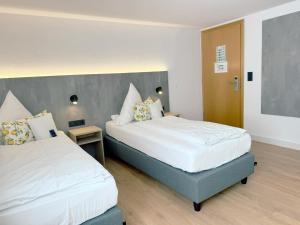 Postel nebo postele na pokoji v ubytování Hotel Restaurant Thum