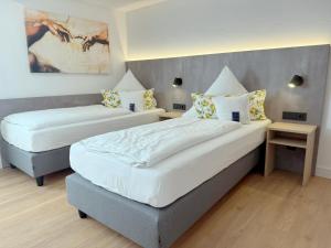 Postel nebo postele na pokoji v ubytování Hotel Restaurant Thum