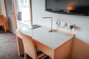 TV a/nebo společenská místnost v ubytování Lynbrook Hotel