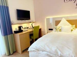 Postel nebo postele na pokoji v ubytování Hotel Restaurant Thum