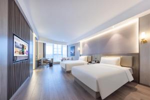 Postel nebo postele na pokoji v ubytování Atour X Hotel Nanjing Jiangbei International Health City