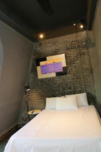Postel nebo postele na pokoji v ubytování Lavender Hotel 202 - Nam Đuống, Thượng Thanh, Long Biên