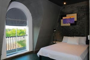 Postel nebo postele na pokoji v ubytování Lavender Hotel 202 - Nam Đuống, Thượng Thanh, Long Biên
